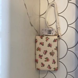 White with pink flowers coach wristlet
